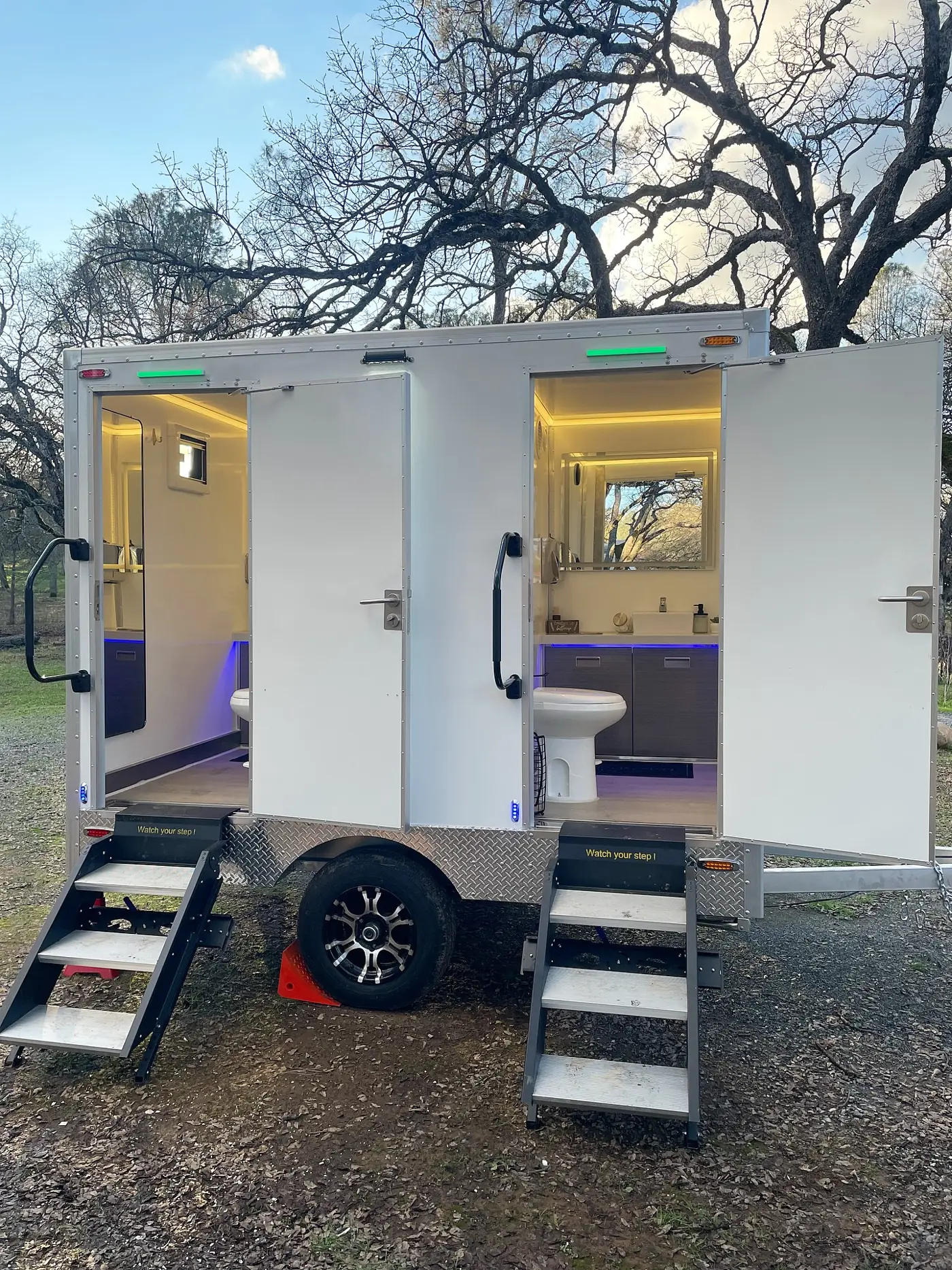 Portable restrooms set up for an event, the kind of setup used in Plum