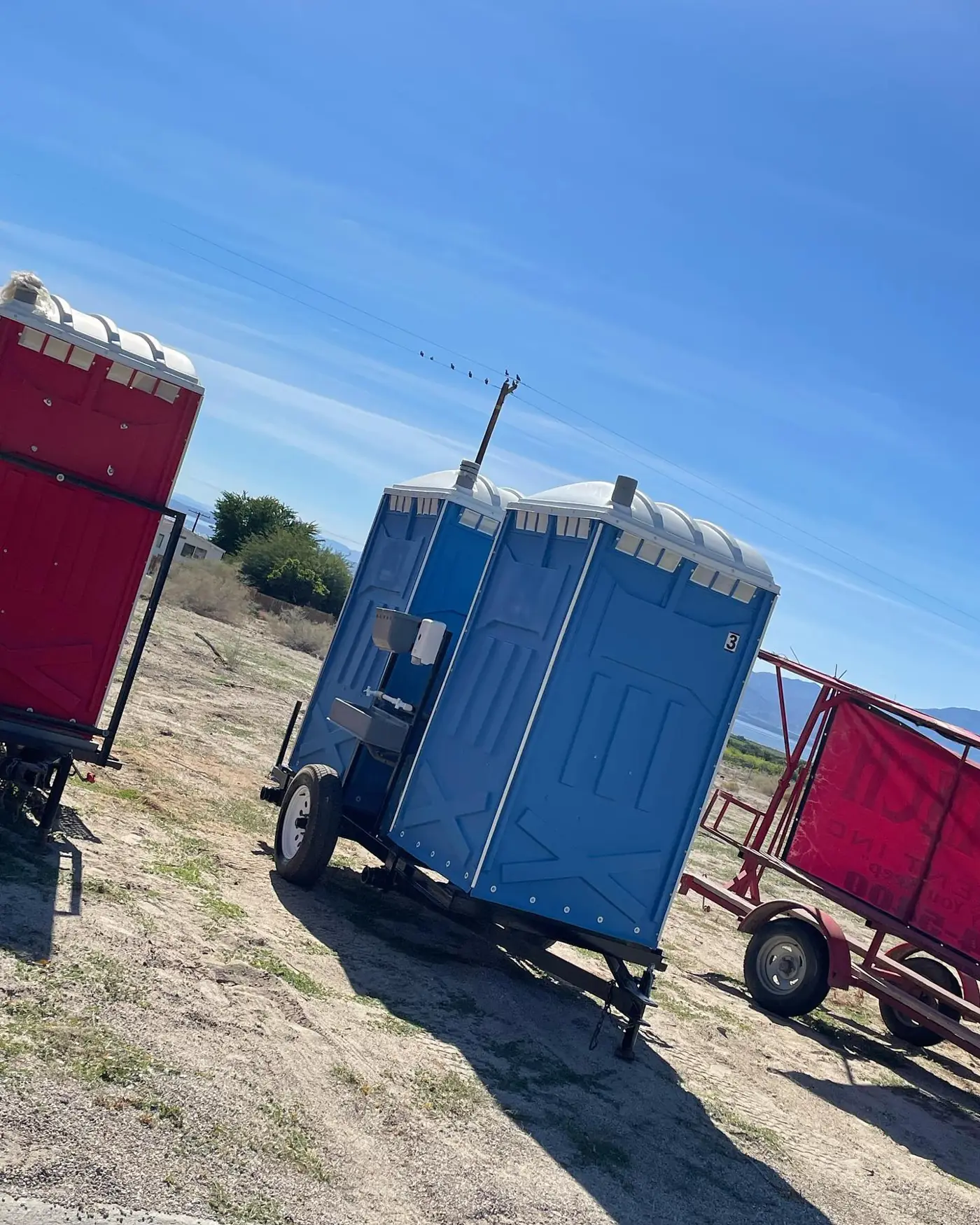 Portable restrooms set up for an event, the kind of setup used in Lancaster